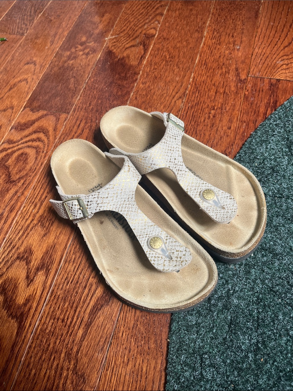 Gold snake effect Birkenstock Gizeh sandals
